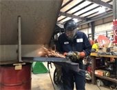 Grinding a plow blade